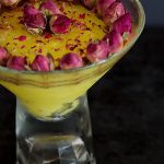 Persian Saffron Rice Pudding decorated with dried rose buds