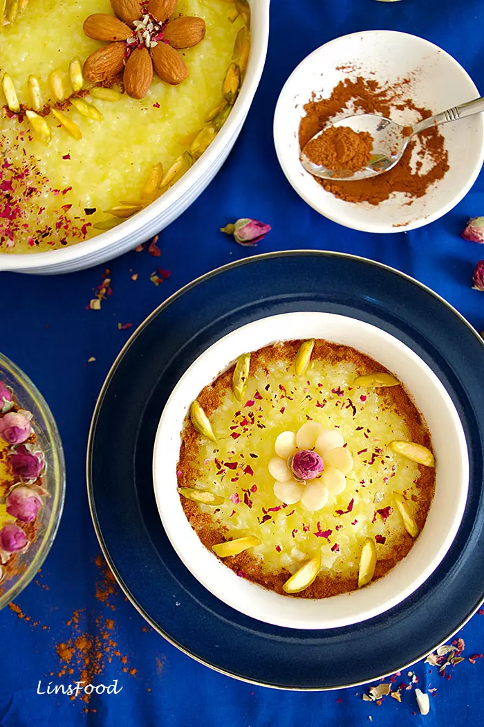 Persian Saffron Rice Pudding simply decorated, in a white bowl