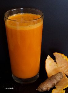 orange coloured drink, dark background