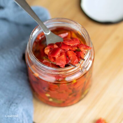 preserved chillies in oil in a glass jar