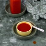 red hot sauce, sriracha, in a small yellow bowl