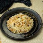 Egyptian rice with vermicelli (Roz bel Shai'riya) on a black Arabic plate
