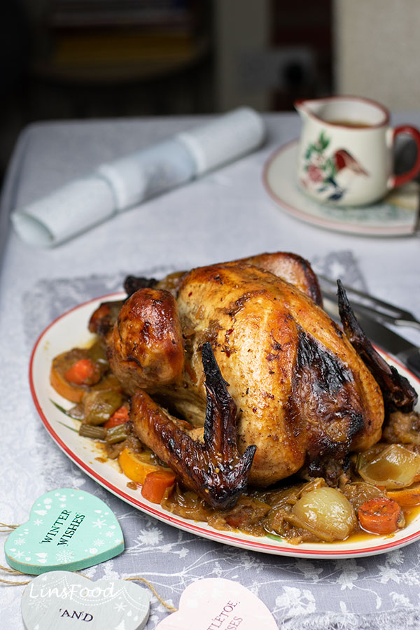Festive marmalade roast turkey with orange slices and vegetables