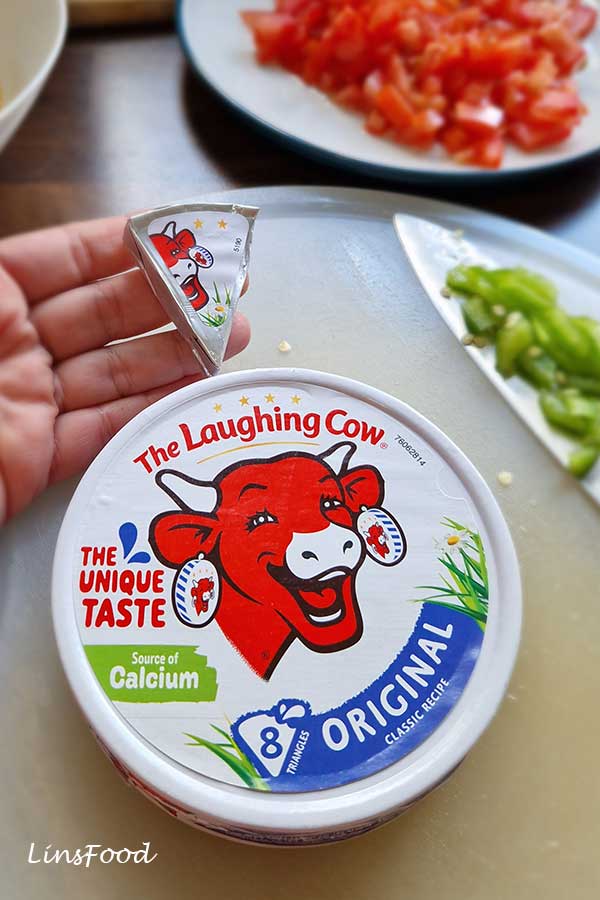 Laughing Cow cheese triangles used as a substitute for liquid cheese in Yemeni lahsa.