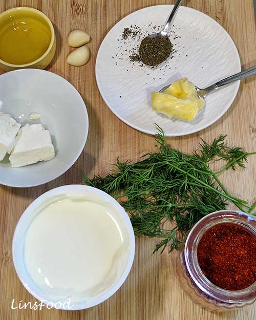 Haydari ingredients including Greek yoghurt, feta, garlic, dill, butter, dried mint and pul biber