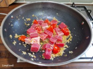 Fresh tuna chunks added to garlic, chillies and tomatoes for paplou