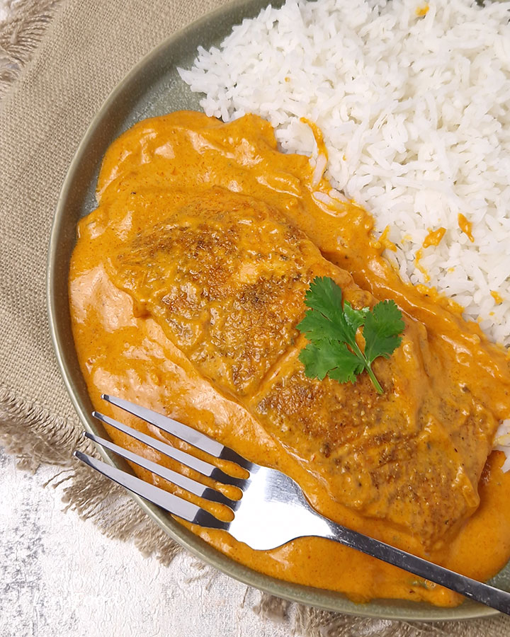 salmon in a creamy curry sauce with white rice